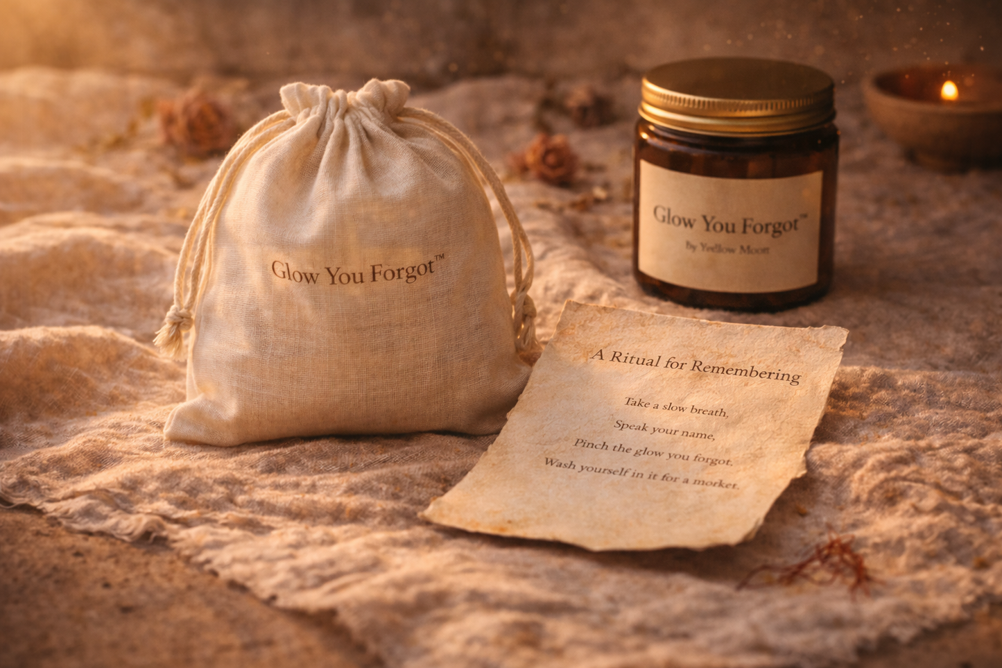 Glow You Forgot candle, drawstring bag, and ritual card on textured surface